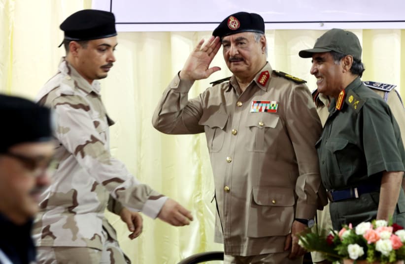 Libya's eastern-based commander Khalifa Haftar salutes as he participates in General Security conference, in Benghazi, Libya, October 14, 2017 (photo credit: REUTERS/ESAM OMRAN AL-FETORI)