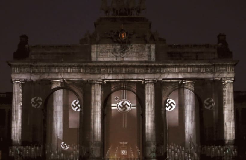 Swastikas displayed in Brussels as part of a light show recalling the Nazi era. (photo credit: REUTERS/FRANCOIS LENOIR)