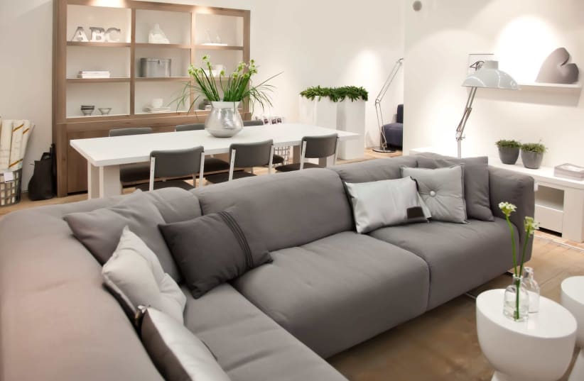 Consider placing the sofa set in the corner of the room to preserve space and emphasize the room's fresh look (photo credit: SHUTTERSTOCK)