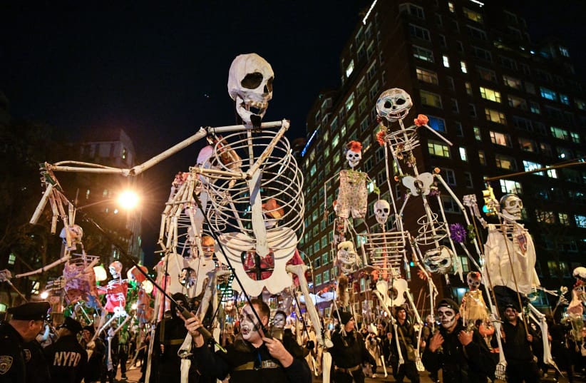 Halloween revelers attend the 44th Annual Village Halloween Parade on October 31, 2017 in New York City (photo credit: DIA DIPASUPIL / GETTY IMAGES NORTH AMERICA / AFP)