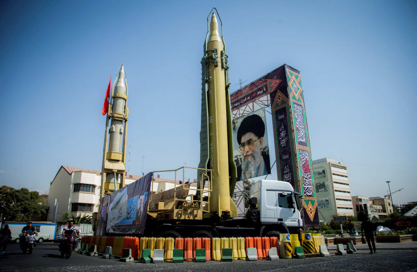 Missiles and a portrait of Iran's Supreme Leader Ayatollah Ali Khamenei in Baharestan Square in Tehran, Iran (photo credit: NAZANIN TABATABAEE YAZDI/ TIMA VIA REUTERS)