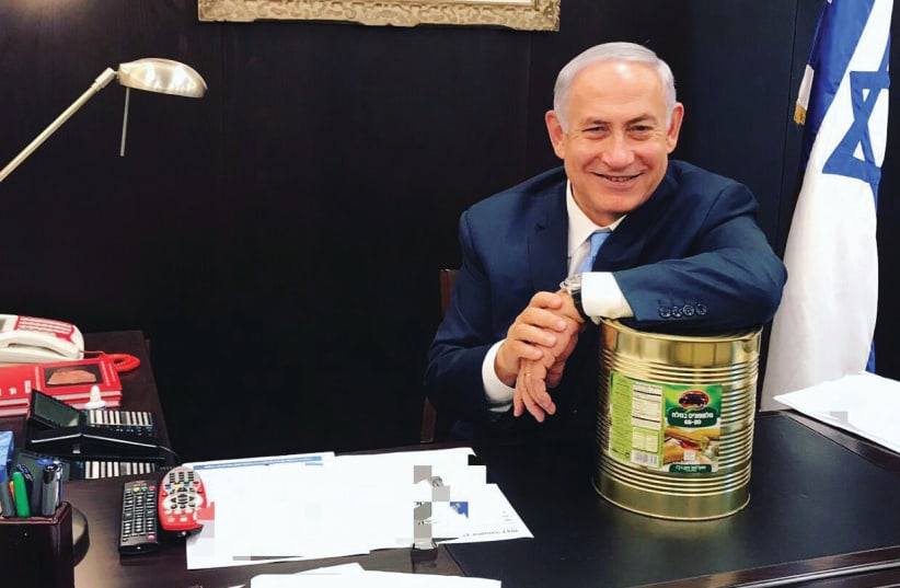 PRIME MINISTER Benjamin Netanyahu recently posted a Twitter photo of himself and an industrial-size tin of pickles – or lefty ‘sourpusses,’ depending on your interpretation (photo credit: TWITTER)