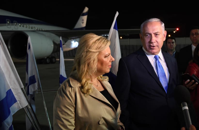 Prime Minister Benjamin Netanyahu and his wife Sara boarding a flight to London, November 1, 2017. (photo credit: GPO PHOTO DEPARTMENT)