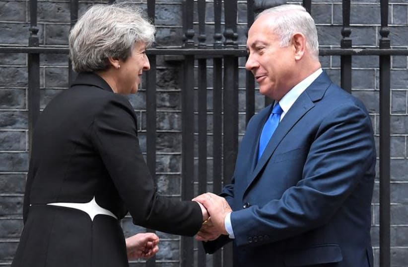 Britain's Prime Minister Theresa May welcomes Israel's Prime Minister Benjamin Netanyahu outside 10 Downing Street in London (photo credit: TOBY MELVILLE/REUTERS)