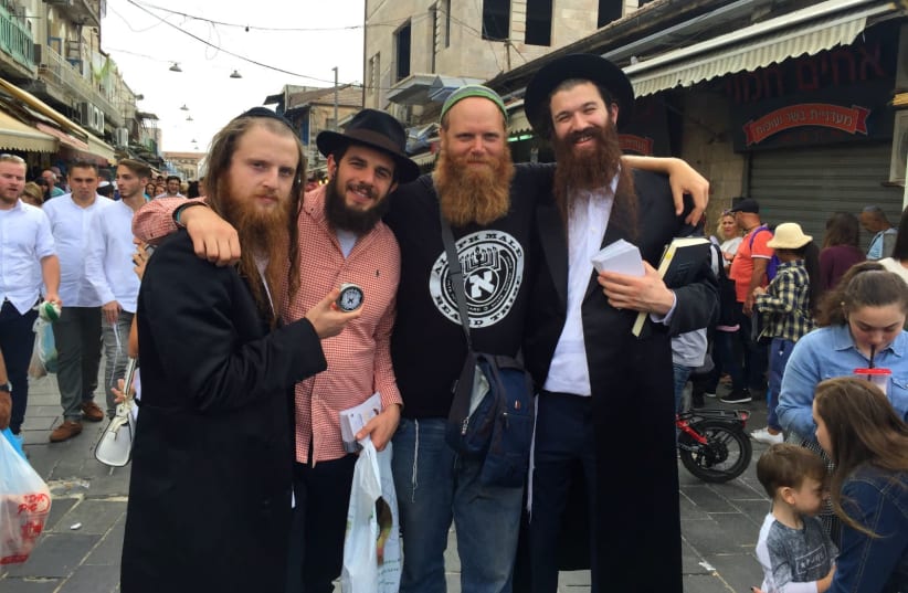 Eitan Press (center right) stands with the band Zusha and their manager. ( Zachariah Goldschmiedt, Paltiel Razenberg, Eitan Press and Shlomo Gaisin) (photo credit: ALEPH MALE)