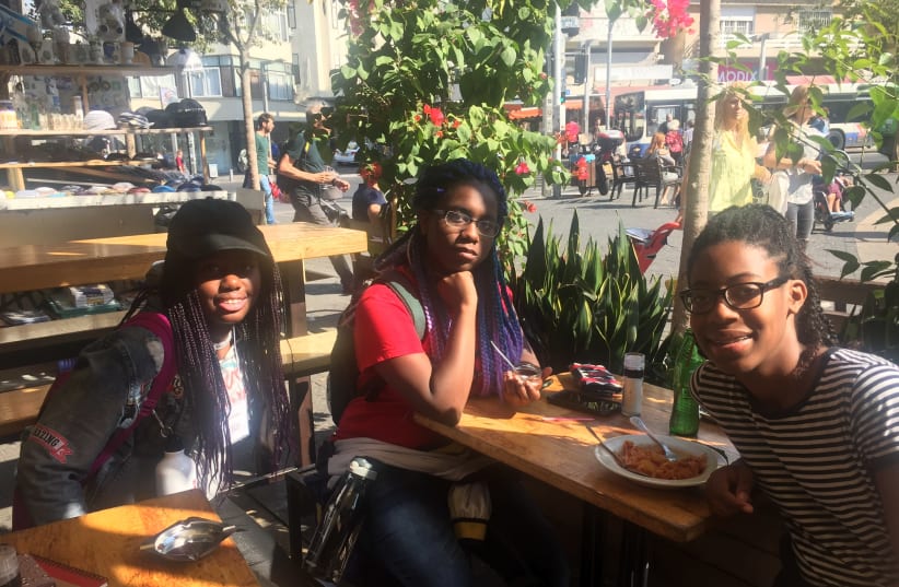 From left to right: Jasmine Johnson, Aaliyah Fontaine and Alexia Newell at Carmel Market in Tel Aviv on Tuesday, November 7 (photo credit: TAMARA ZIEVE)