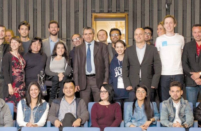 JERUSALEM AFFAIRS Minister Ze’ev Elkin (center) poses with entrepreneurs visiting the city, who were invited after winning local competitions set up by Israeli missions worldwide. (photo credit: COURTESY ELAD BRAMI/JDA)