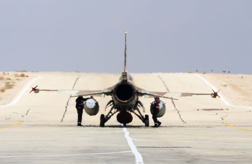 Israeli F16 belonging to Squadron 115, the Flying Dragon (Red Squadron) taxis to runway at Uvda airbase (photo credit: ANNA AHRONHEIM)