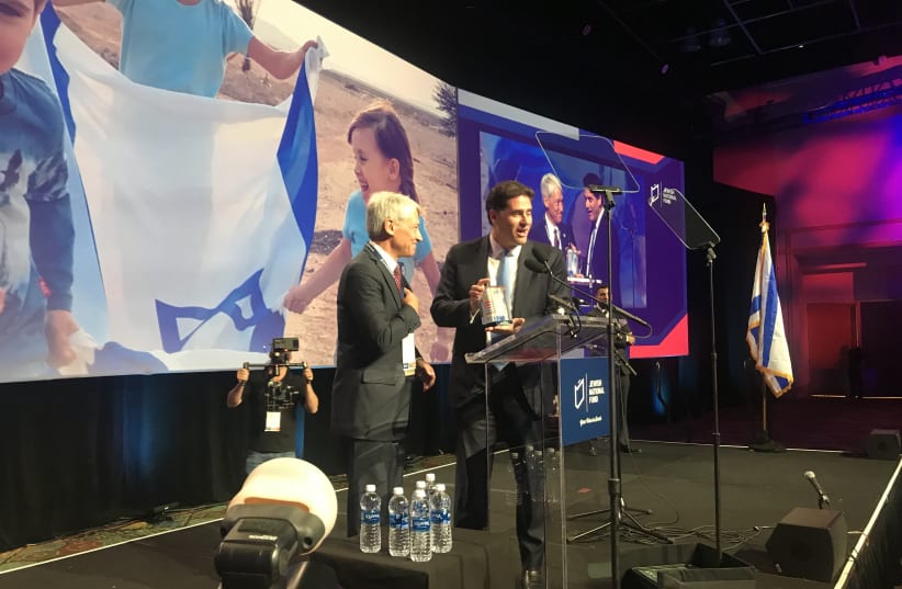 Joe Wolfson presents Ambassador Ron Dermer with a Jewish National Fund Blue Box  (photo credit: PR)
