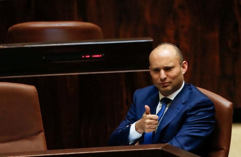 Israeli Education Minister Naftali Bennett gestures during a preliminary vote on a bill at the Knesset, the Israeli parliament, in Jerusalem November 16, 2016 (photo credit: REUTERS/AMMAR AWAD)