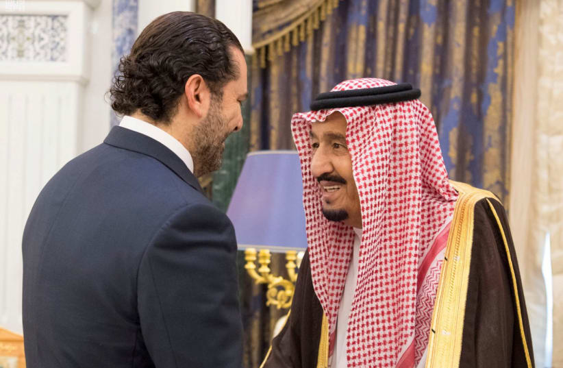 Saudi Arabia's King Salman bin Abdulaziz Al Saud shakes hands with former Lebanese Prime Minister Saad al-Hariri during their meeting in Riyadh (photo credit: SAUDI PRESS AGENCY/HANDOUT VIA REUTERS)