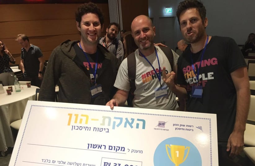 HiBob engineers Lior Harel, Doron Cyngiser and Omri Hecht win the gold at the Tel Aviv Stock Exchange’s Pension and Insurance Hackathon. (photo credit: TASE)