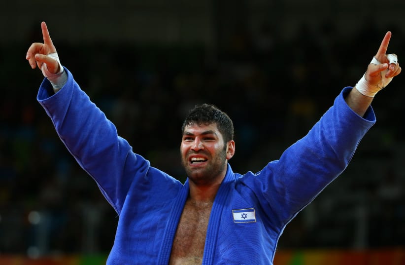 Israeli Judoka Or Sasson celebrates a win (photo credit: REUTERS/MURAD SEZER)
