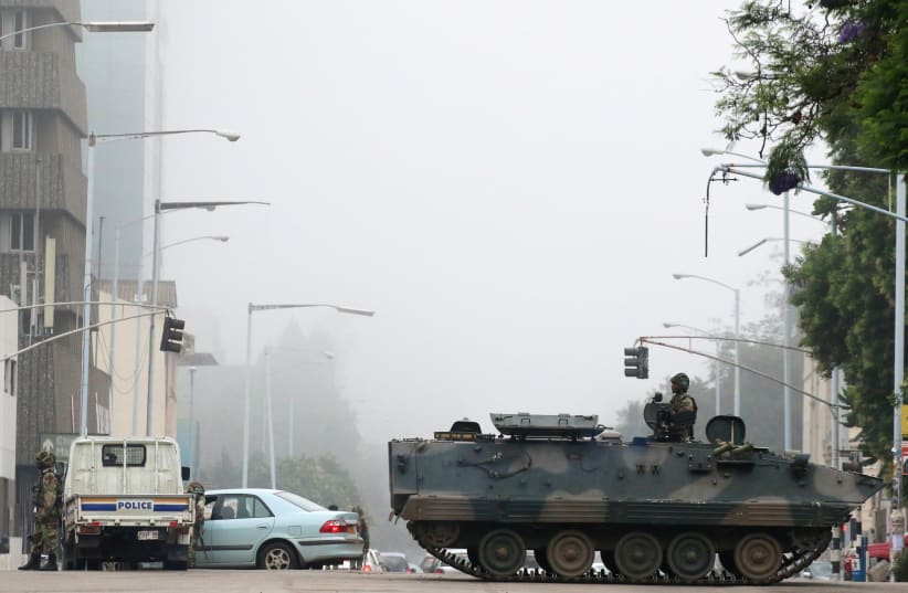 Military vehicles and soldiers patrol the streets in Harare, November 15, 2017. (photo credit: REUTERS)