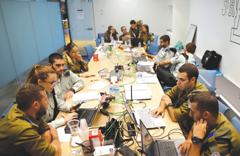 IDF SOLDIERS take part in a cyber security training course at the iNT Institute of Technology and Innovation in Beersheba in August (photo credit: REUTERS/AMIR COHEN)