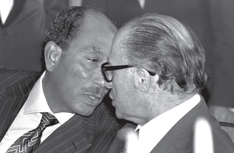 ANWAR SADAT and Menachem Begin chat during the former Egyptian president’s historic visit to Jerusalem in 1977.  (photo credit: REUTERS)