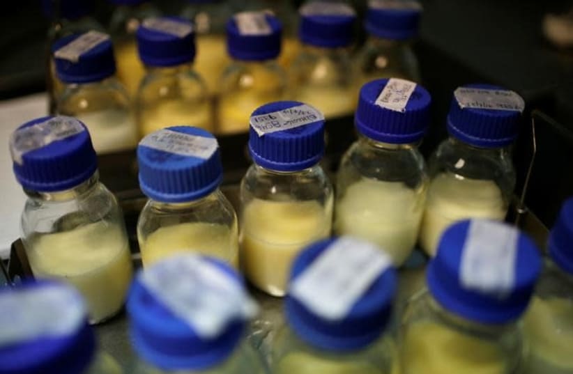 Bottles with breast milk donated by nursing mothers (photo credit: REUTERS/SAUL MARTINEZ)