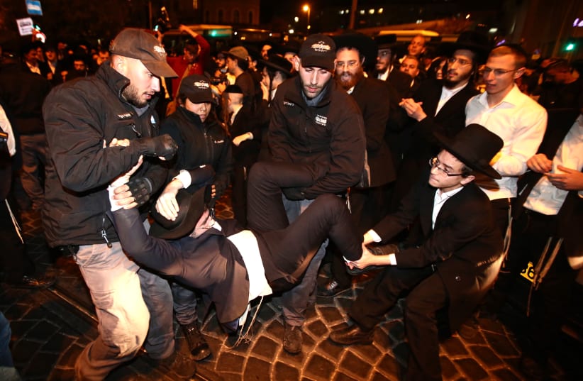 Extremist haredi men protest against jail sentences for draft dodgers. (photo credit: MARC ISRAEL SELLEM/THE JERUSALEM POST)