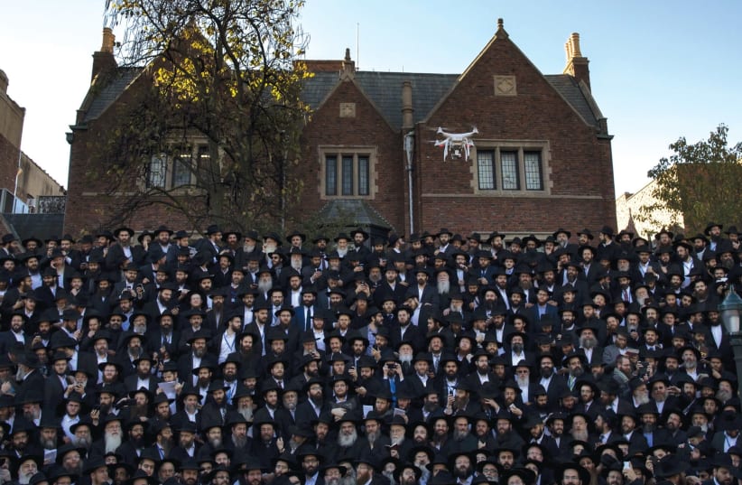 CHABAD members pose for a photo at their New York headquarters. (photo credit: REUTERS)