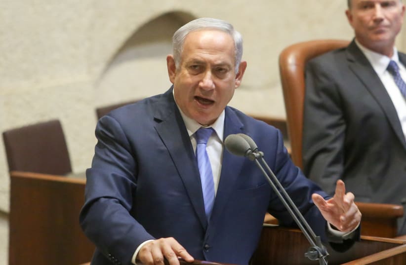 Prime Minister Benjamin Netanyahu speaks at a special Knesset session marking 40 years since Anwar Sadat's address to Israeli parliament.  (photo credit: MARC ISRAEL SELLEM/THE JERUSALEM POST)
