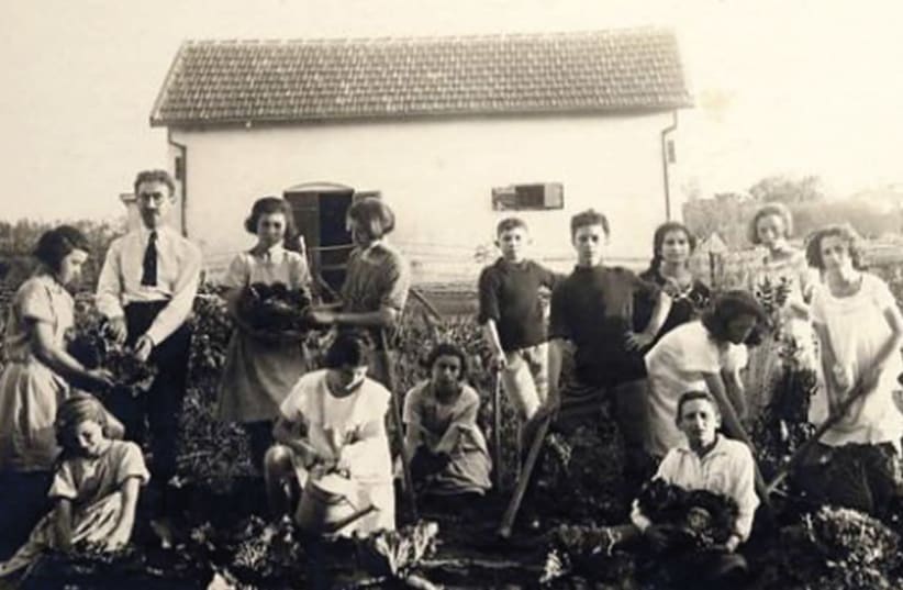 An outdoor lesson in the vegetable garden in the Palestine Jewish Colonization Association (PICA) School in Petah Tikva, between 1920 and 1930. (photo credit: Wikimedia Commons)