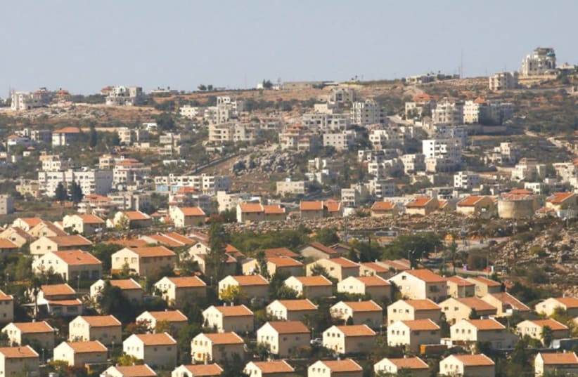 THE OFRA SETTLEMENT is seen from the Amona outpost in the West Bank. (photo credit: RONEN ZVULUN/REUTERS)