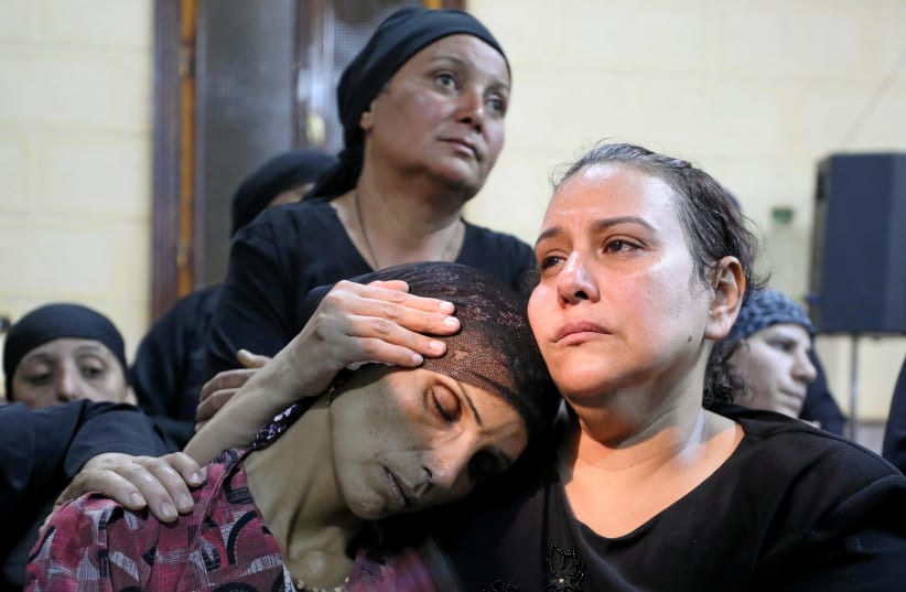 A mother of one of the victims of an attack on a group of Coptic Christians attends a funeral at the Sacred Family Church in Minya (photo credit: MOHAMED ABD EL GHANY/REUTERS)