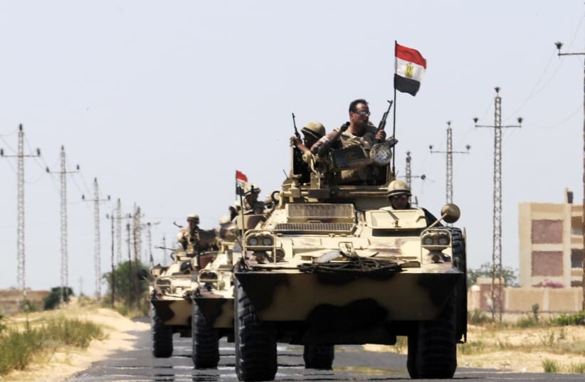 Soldiers in military vehicles proceed towards the al-Jura district in El-Arish city from Sheikh Zuwaid, around 350 km (217 miles) northeast of Cairo May 21, 2013. (photo credit: REUTERS)