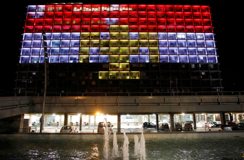 The city hall building in Tel Aviv's Rabin Square in Israel is illuminated in solidarity with Egypt, May 27, 2017.  (photo credit: REUTERS)