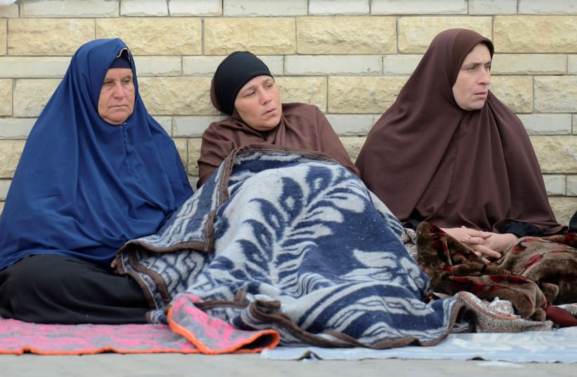 Relatives of victims of the explosion at Al-Rawda mosque, sit outside Suez Canal University hospital in Ismailia, Egypt, 25 November (photo credit: REUTERS/AMR ABDALLAH DALSH)