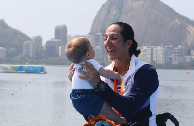 Moran Samuel with her son, Arad, at the Rio Paralympics in 2016 (photo credit: DETLEV SEYEB / KEREN ISAACSON)