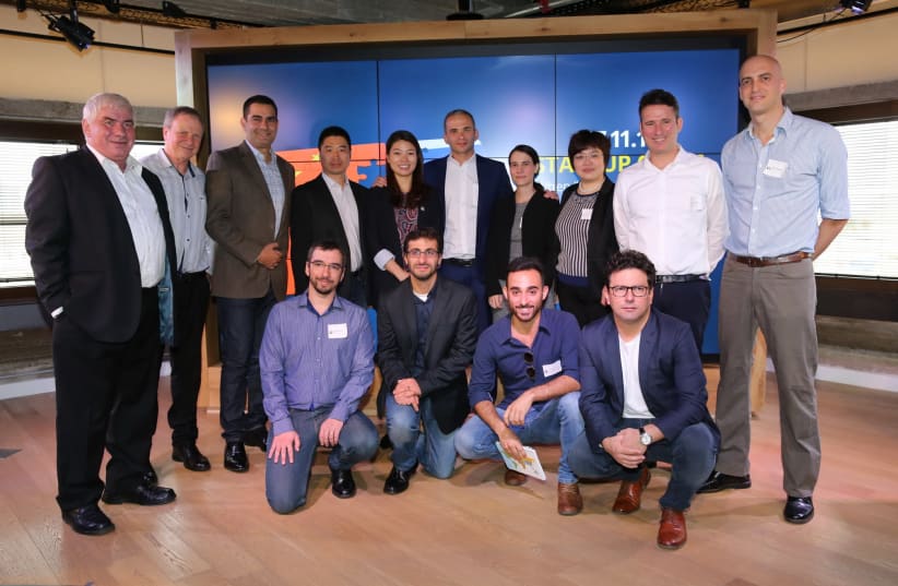 Officials from the Ministry of Economy meet with entrepreneurs from the selected start-ups, along with executives from the Shengjing Group and DayDayUp in Tel Aviv. (photo credit: COURTESY EZRA LEVY)