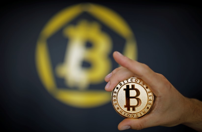 A Bitcoin (virtual currency) coin is seen in an illustration picture (photo credit: BENOIT TESSIER/REUTERS)