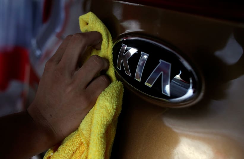 The logo of KIA Motor at car dealership (photo credit: REUTERS/DANIEL BECERRIL)