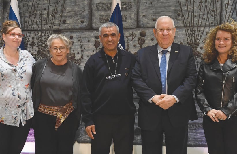 PRESIDENT REUVEN RIVLIN and his wife, Nechama (second from left), host (from left) Vered Shirazi, Adnan Haj Yihye and Michal Vitori yesterday during an event at the President’s Residence encouraging organ donations. (photo credit: MARK NEYMAN/GPO)