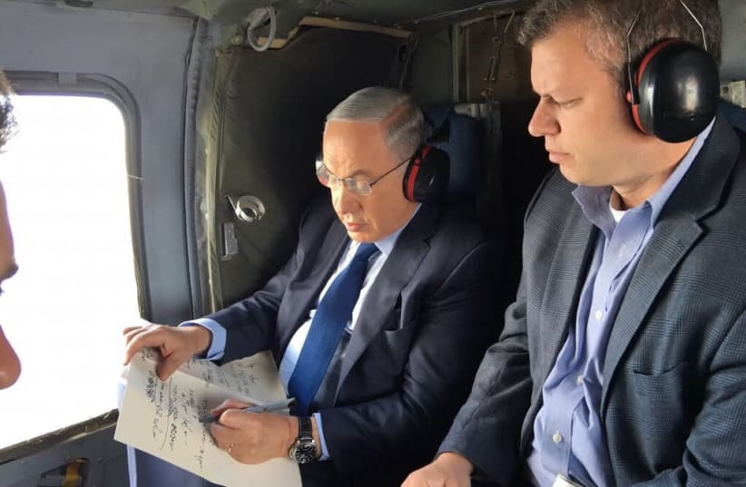 Eli Groner, director general of the PMO, with Benjamin Netanyahu on a recent helicopter flight (photo credit: Courtesy)