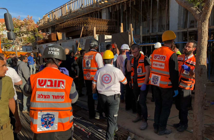 Emergency personnel survey the site of a building collapse in Beitar Illit on December 4th.  (photo credit: COURTESY UNITED HATZALAH)