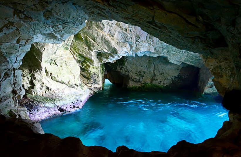 The magnificent blue water at the entrance to Rosh Hanikra caves welcomes visitors. (photo credit: ITSIK MAROM)