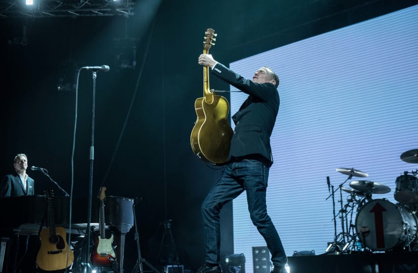 Bryan Adams performs at the Menorah Mivtachim Arena in Tel Aviv, December 4, 2017 (photo credit: LIOR KETER)