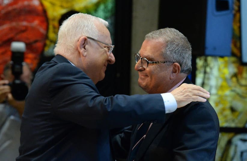Israeli President Reuven Rivlin and national chairman for the Organization of Victims of Terrorism Abie Moses (photo credit: Mark Neiman/GPO)