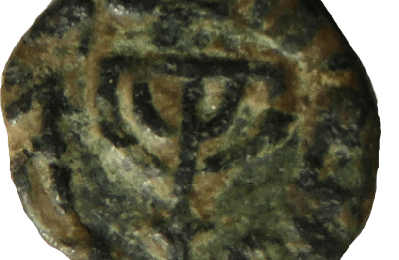 A Muslim coin with a menorah symbol. (photo credit: COURTESY OF ASSAF AVRAHAM)