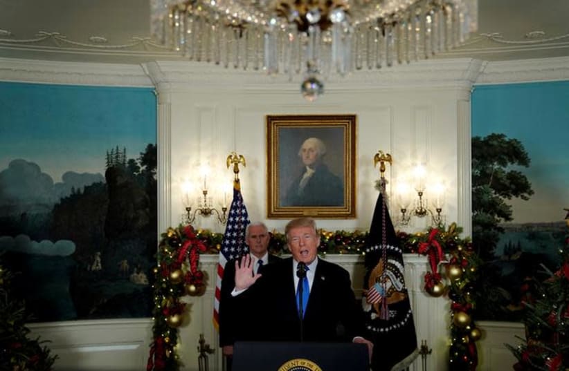 US President Donald Trump, flanked by Vice President Mike Pence, delivers remarks recognizing Jerusalem as the capital of Israel at the White House in Washington, US December 6, 2017. (photo credit: JONATHAN ERNST / REUTERS)