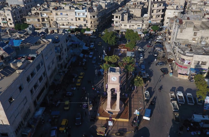A GENERAL view taken with a drone shows the Clock Tower of the rebel-held Idlib city, Syria in June. (photo credit: REUTERS)