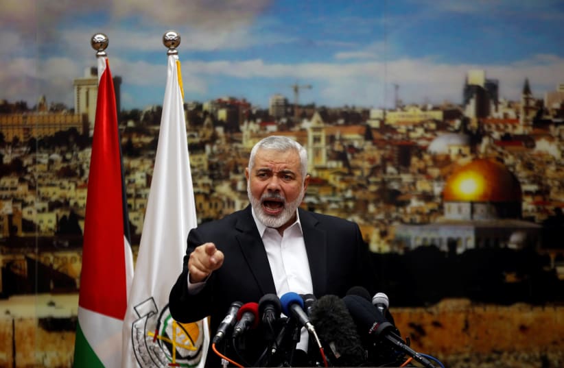 Hamas Chief Ismail Haniyeh gestures as he delivers a speech over U.S. President Donald Trump's decision to recognize Jerusalem as the capital of Israel, in Gaza City December 7, 2017 (photo credit: MOHAMMED SALEM/REUTERS)
