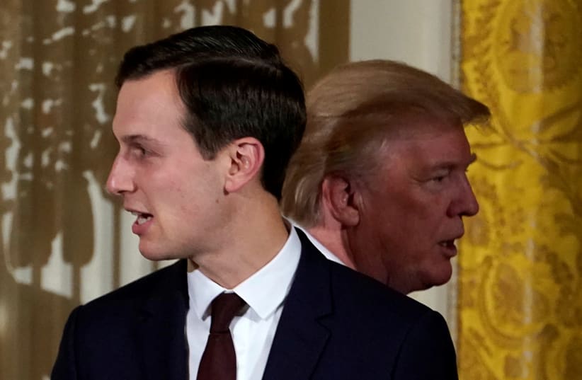 President Donald Trump passes his adviser and son-in-law Jared Kushner during a Hanukkah Reception at the White House (photo credit: KEVIN LAMARQUE/REUTERS)