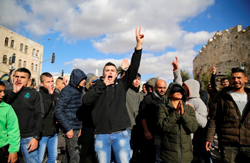Palestinians in the Old City of Jerusalem shout slogans in protest against US recognition of Jerusalem (photo credit: AMMAR AWAD / REUTERS)