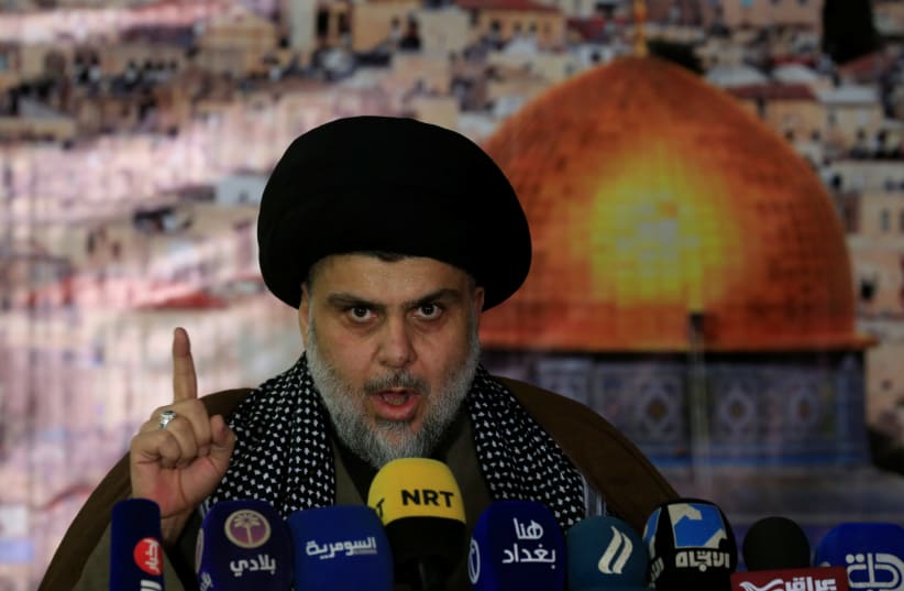Iraqi Shi'ite Muslim leader Moqtada al-Sadr gestures as he delivers a speech over US President Donald Trump's decision to recognize Jerusalem as the capital of Israel, in Baghdad, Iraq December 7, 2017. (photo credit: REUTERS)