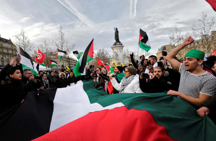 Activists protest against the visit of Israel's Prime Minister Benjamin Netanyahu in Paris, France, December 9, 2017.  (photo credit: REUTERS)
