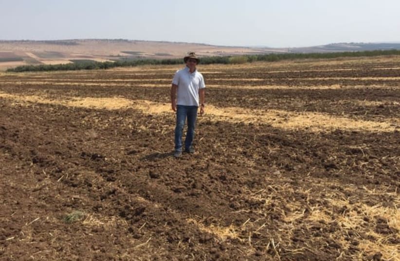 David Tavdi walks on farmland in Israel (photo credit: Courtesy)