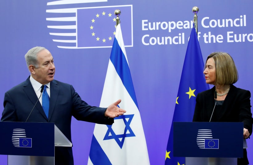 Netanyahu and EU foreign policy chief Mogherini brief the media in Brussels (photo credit: REUTERS/FRANCOIS LENOIR)